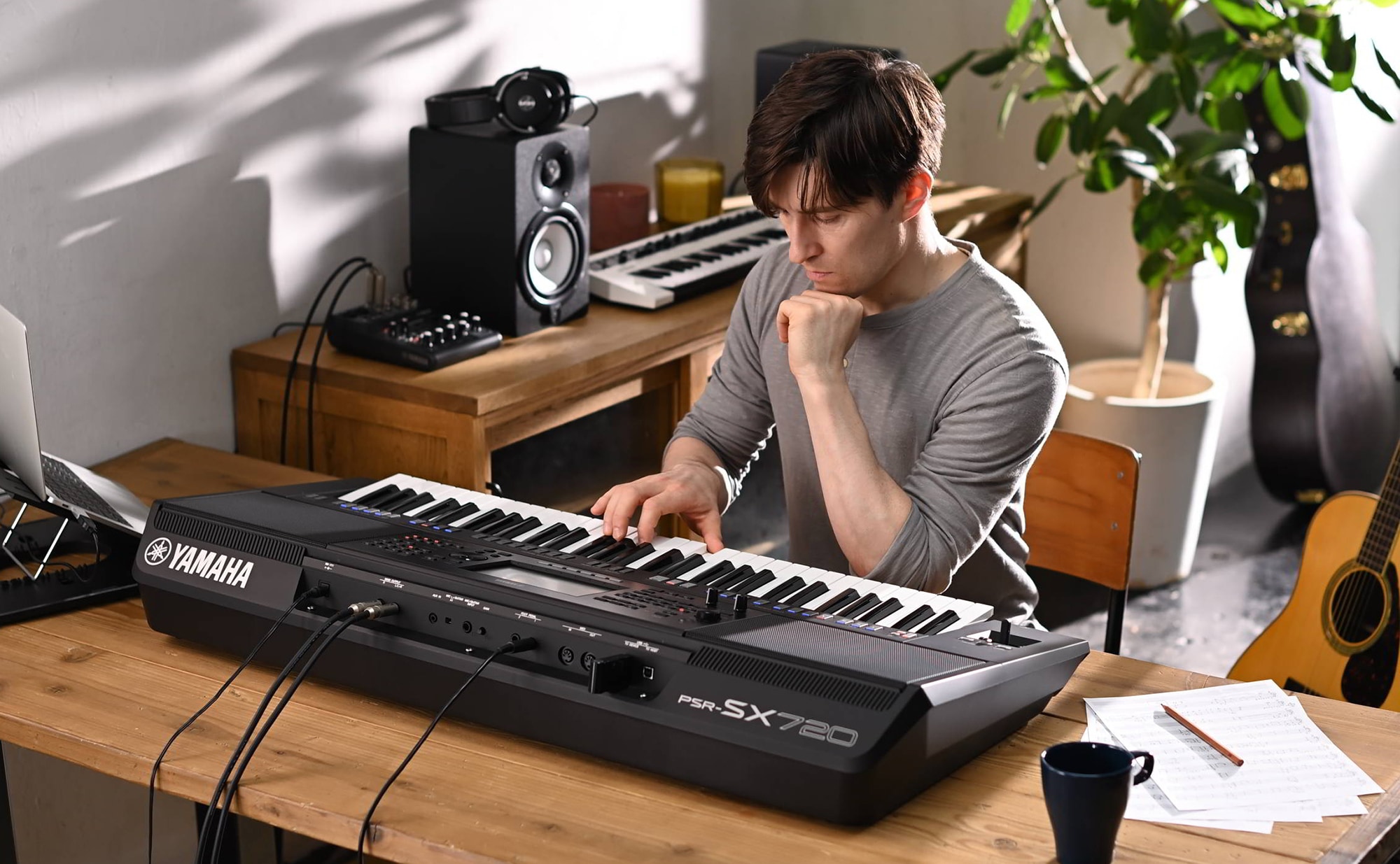 Photo of a person playing Yamaha Arranger Workstation PSR-SX720