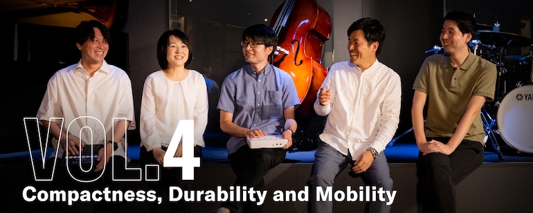 Five engineers conversing with the FGDP in their hands