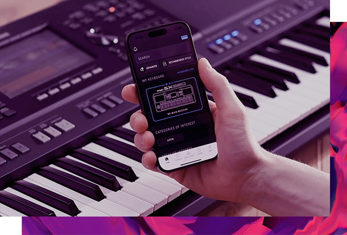 Yamaha Arranger Workstation Keyboard and a hand holding a smartphone with the Yamaha official app “Expansion Explorer” screen