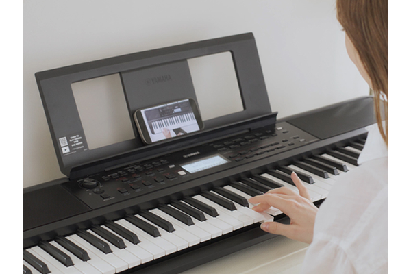 Woman practices Auto Chord Play.